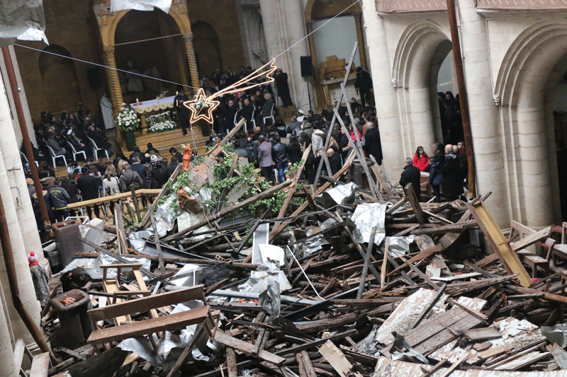 This Syrian church met for a Christmas service despite the back of the church being destroyed