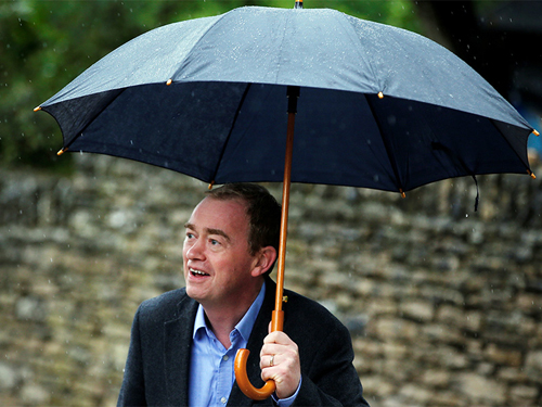 Tim Farron with umbrella