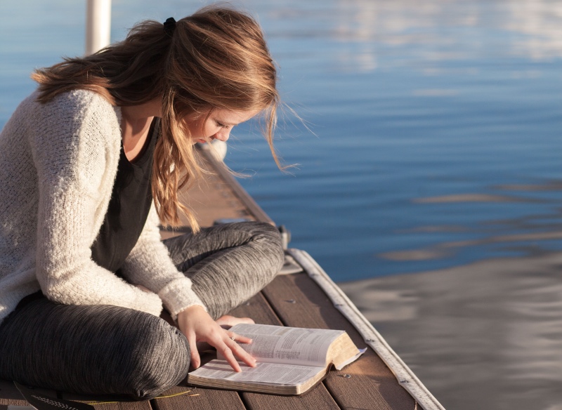 Bible reading on pier
