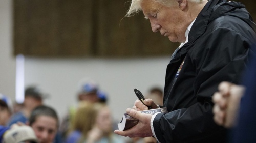 Donald Trump signing Bible