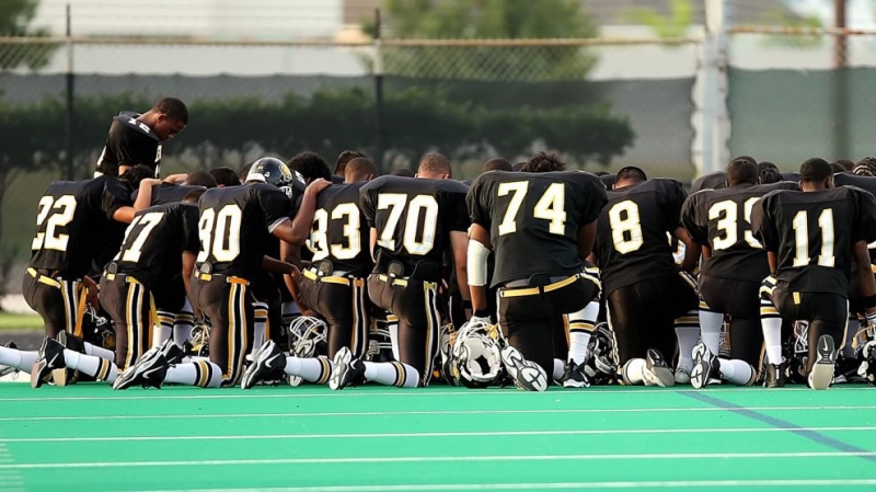 Football team praying