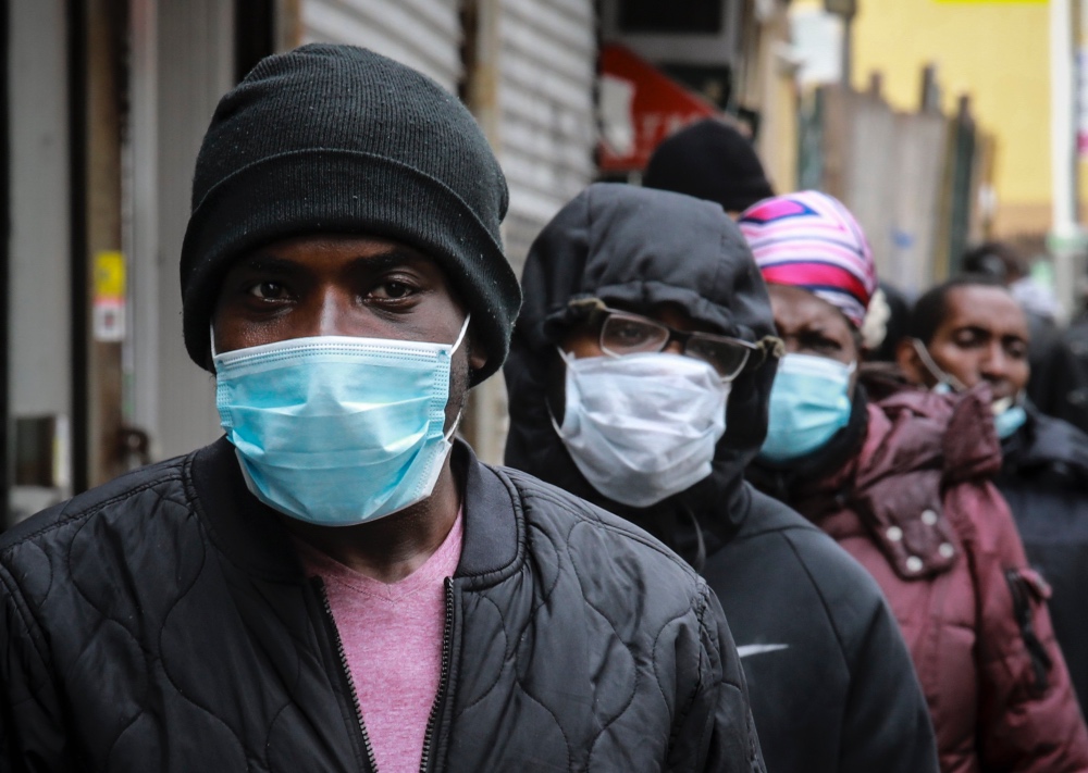 Coronavirus US face mask queue Harlem