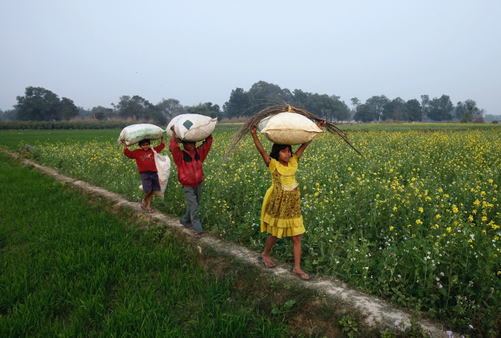 India children in a field