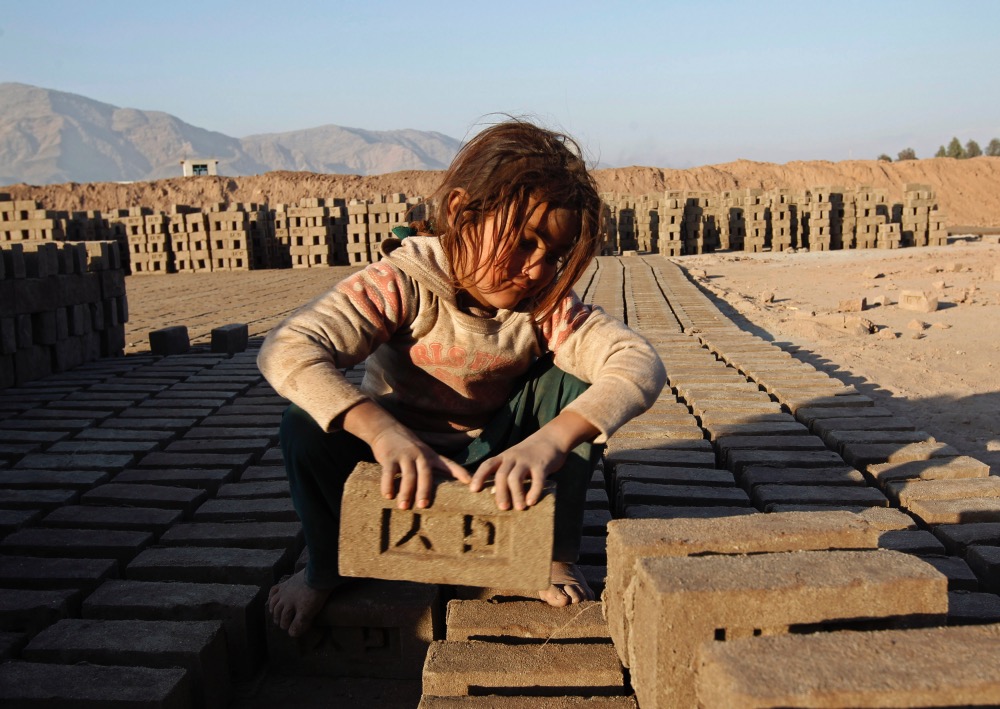 Afghanistan girl brick making