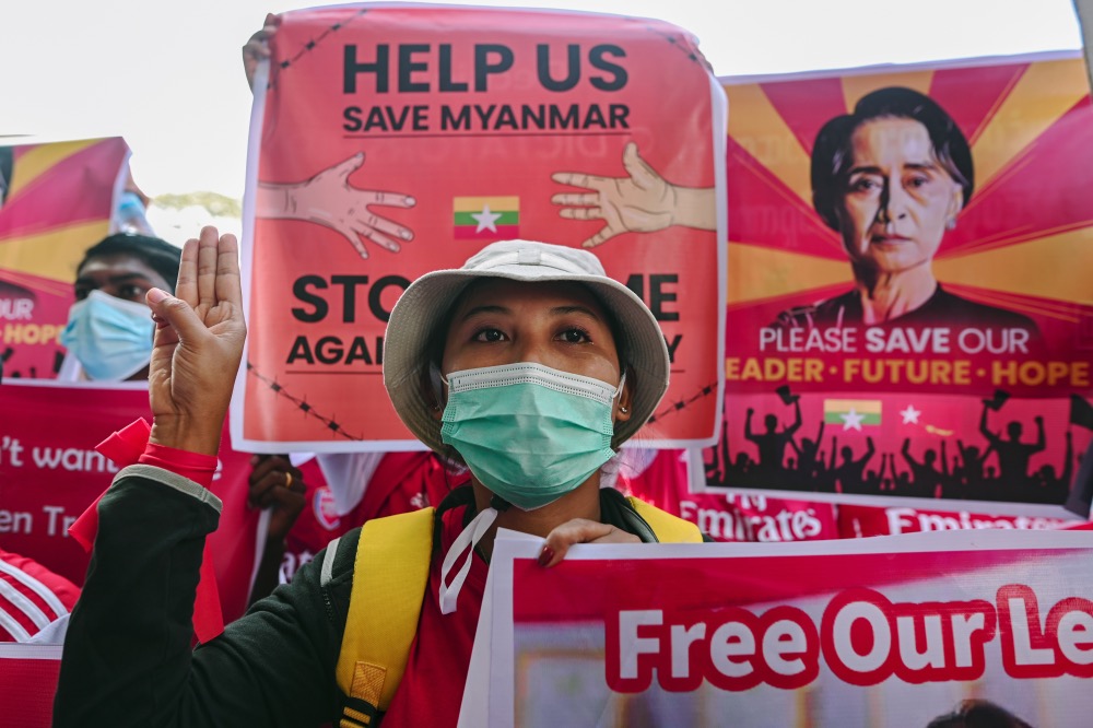 Myanmar military coup protestors signs