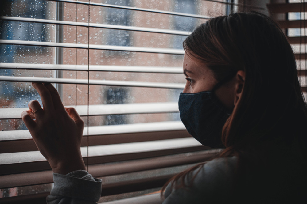 Anxiety woman looking out of window