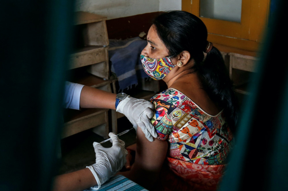 Coronavirus India healthcare worker gets injection