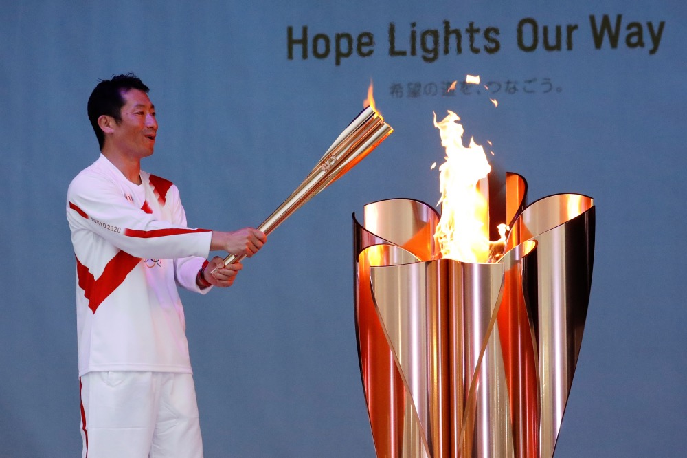 Japan Olympic torch bearer Yoshihide Muroya