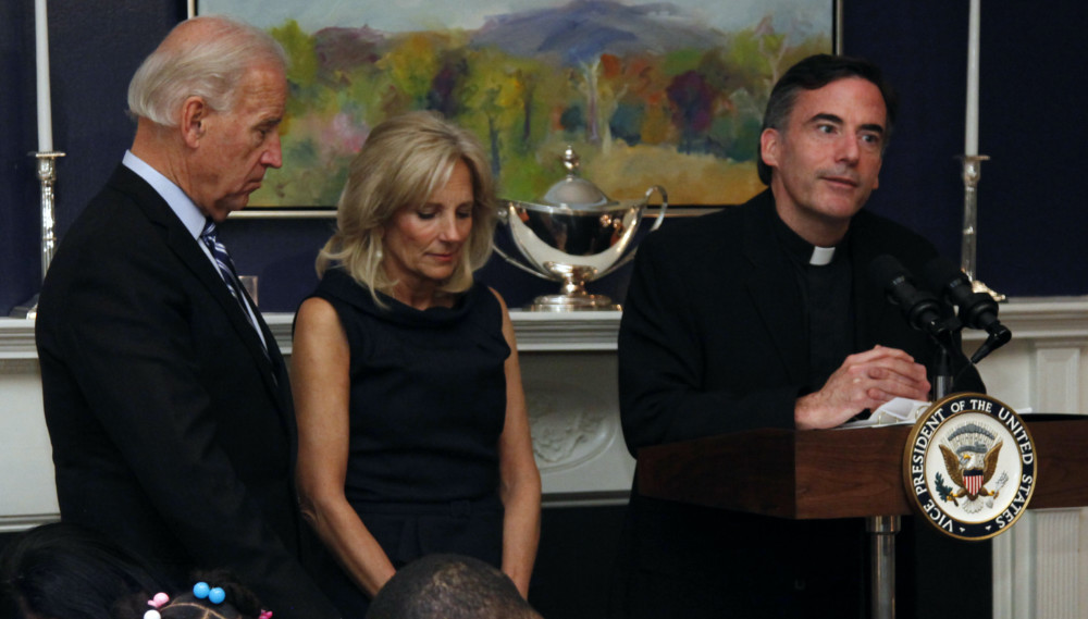 US Joe and Jill Biden and Rev Kevin OBrien
