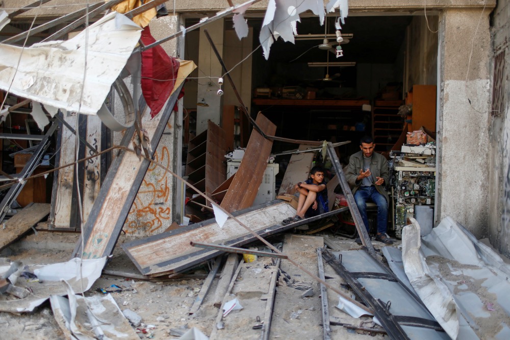 Gaza Family in damaged building