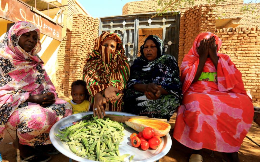 Sudan women at a meal