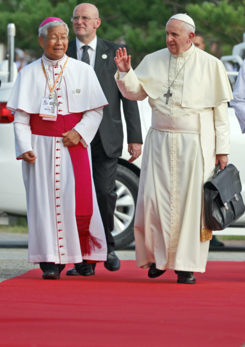 South Korea Dangin Pope Francis walks with Daejeon Bishop Lazarus You Heung sik