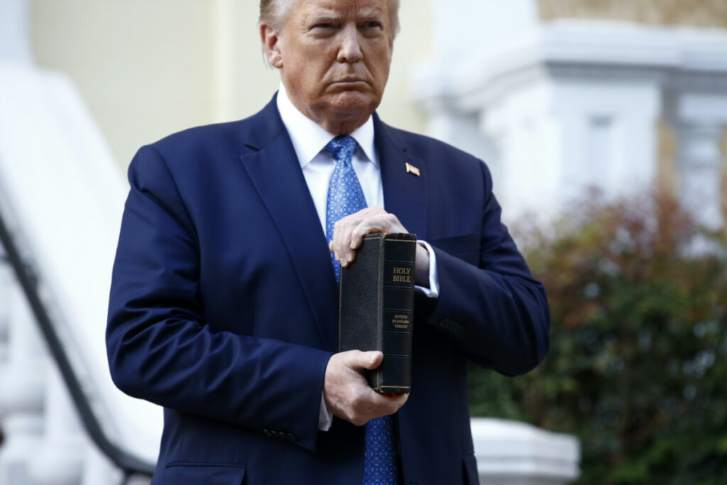 US Washington DC Donald Trump with Bible outside St Johns Church