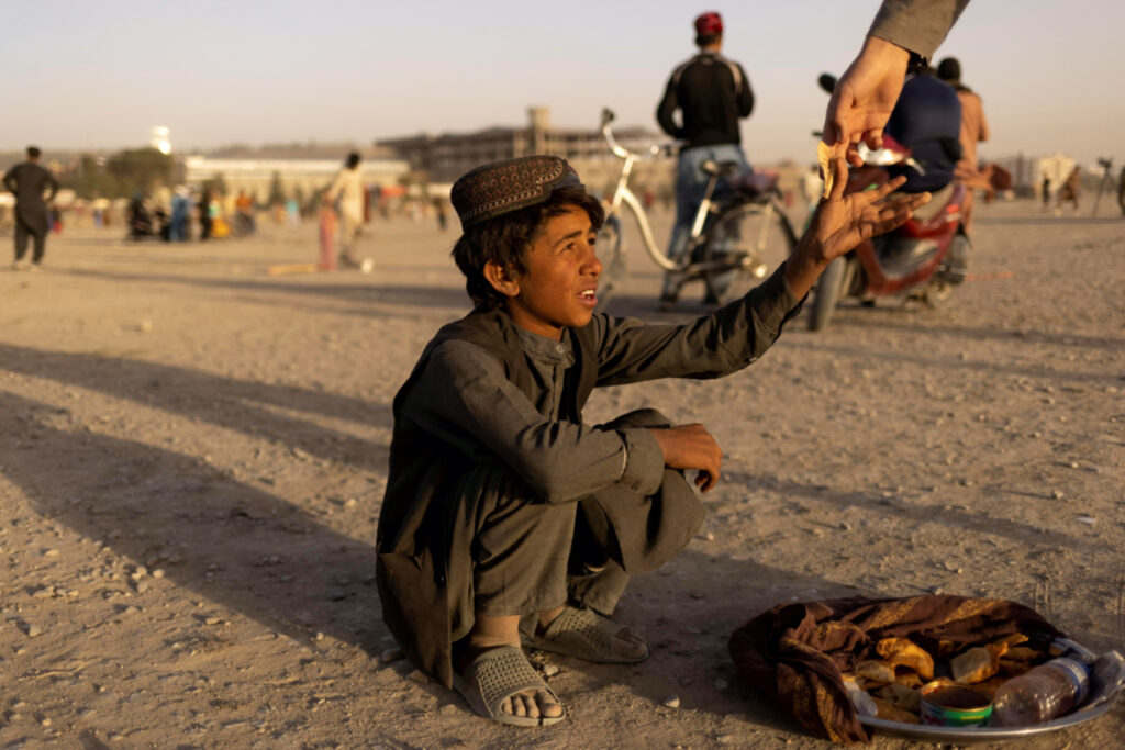 Afghanistan Kabul boy selling bread