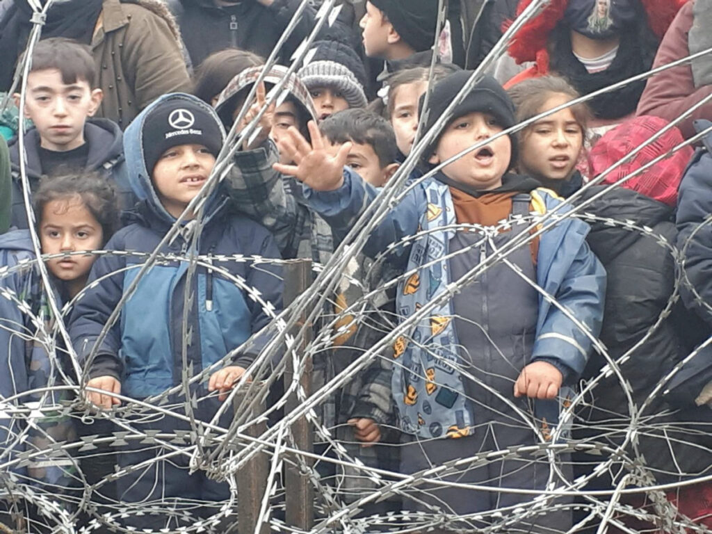 Belarus Poland border children at fence