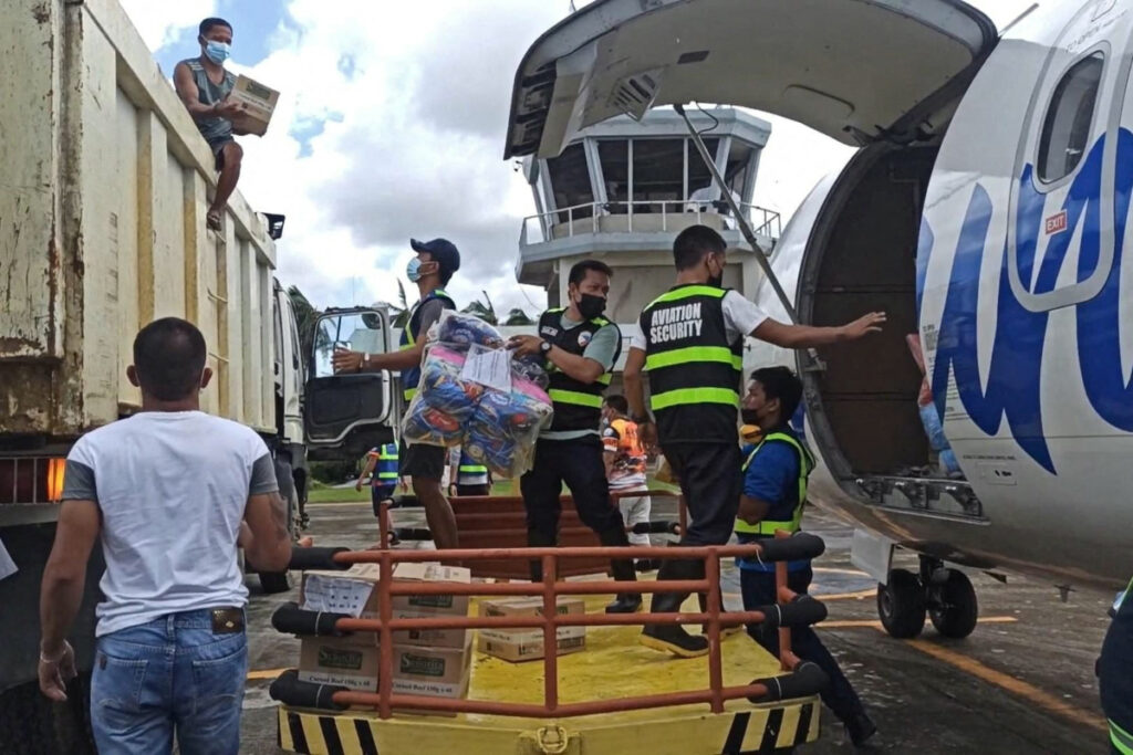 Philippines Typhoon Rai unloading aid