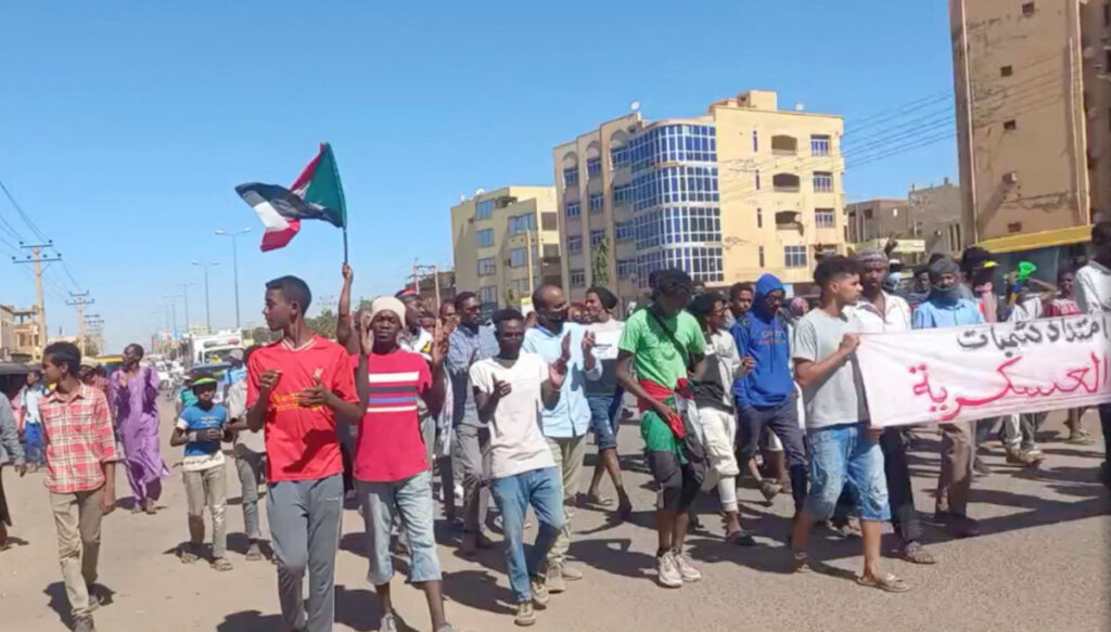 Sudan Khartoum protestors with flag