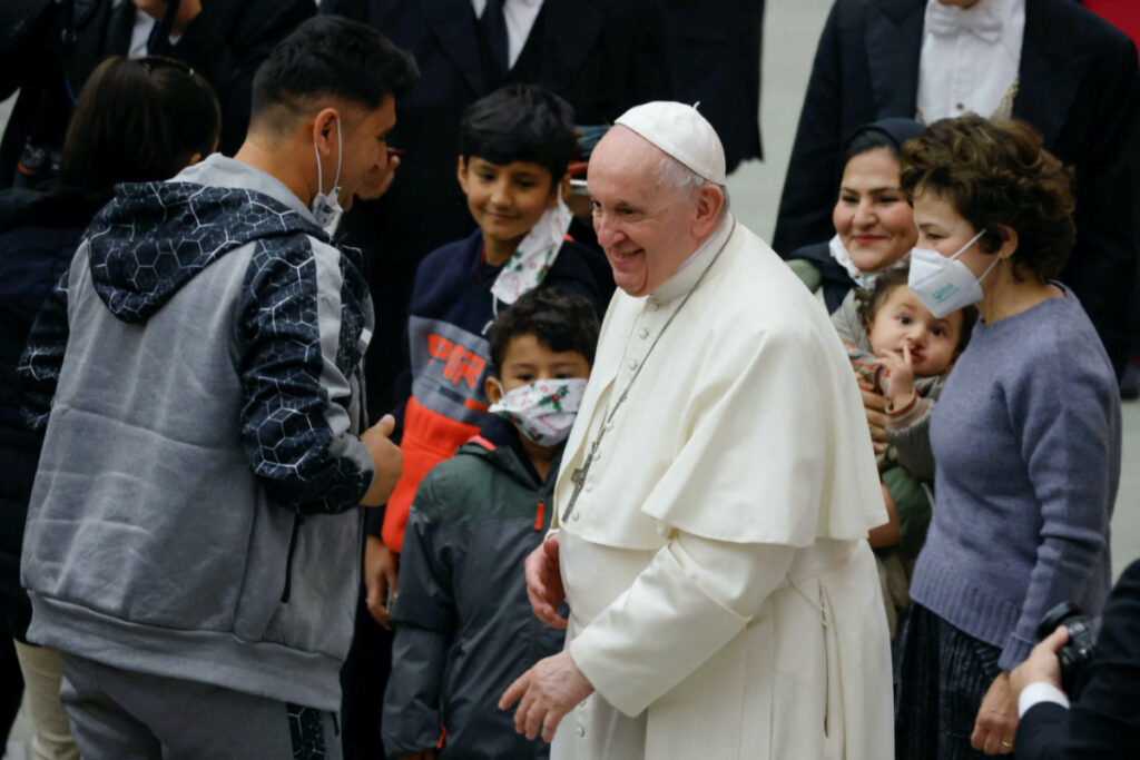 Vatican Pope Francis greets refugee family