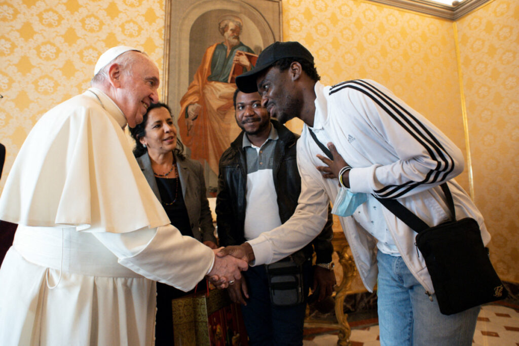 Vatican Pope greets migrants