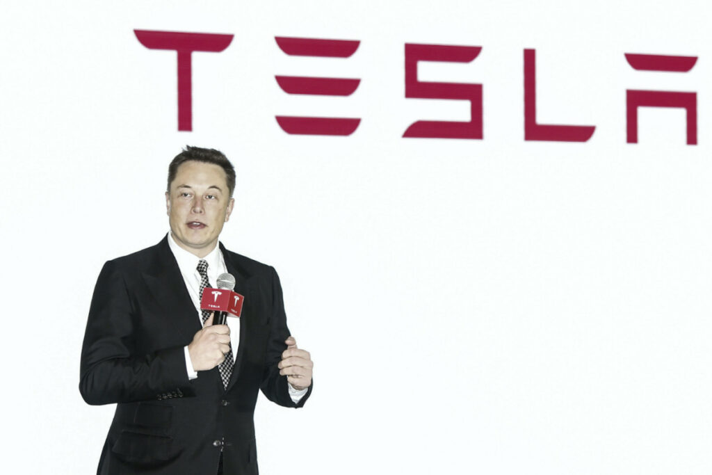 Elon Musk and Tesla sign
