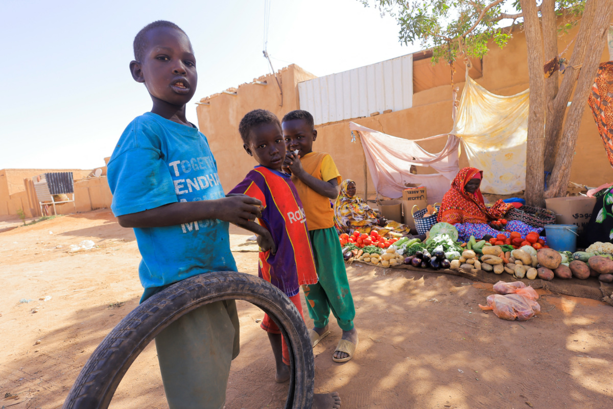 Sudan Khartoum North children at a vegetable market