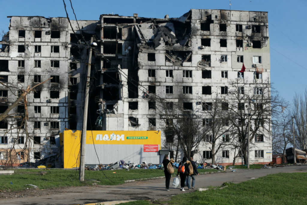 Ukraine Mariupol residents outside apartment building