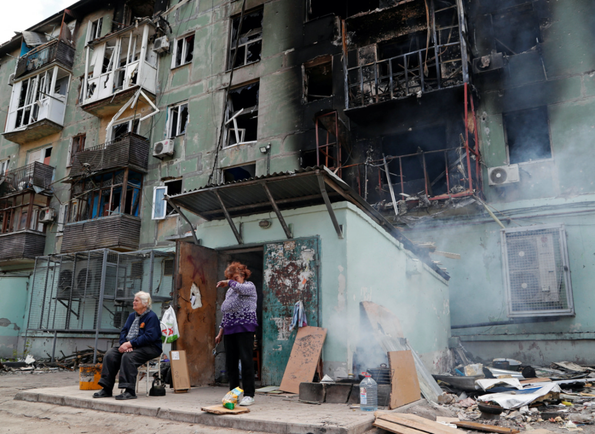 Ukraine Mariupol residents outside apartments