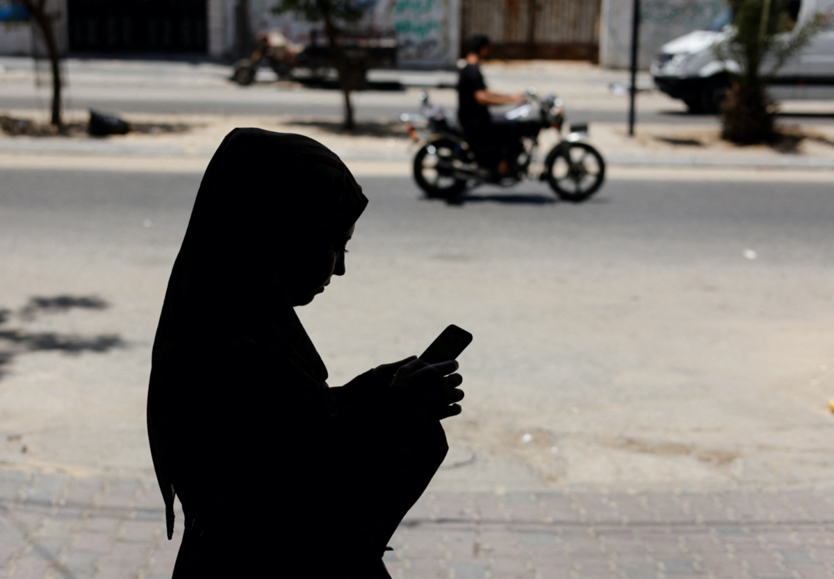 Gaza woman using phone