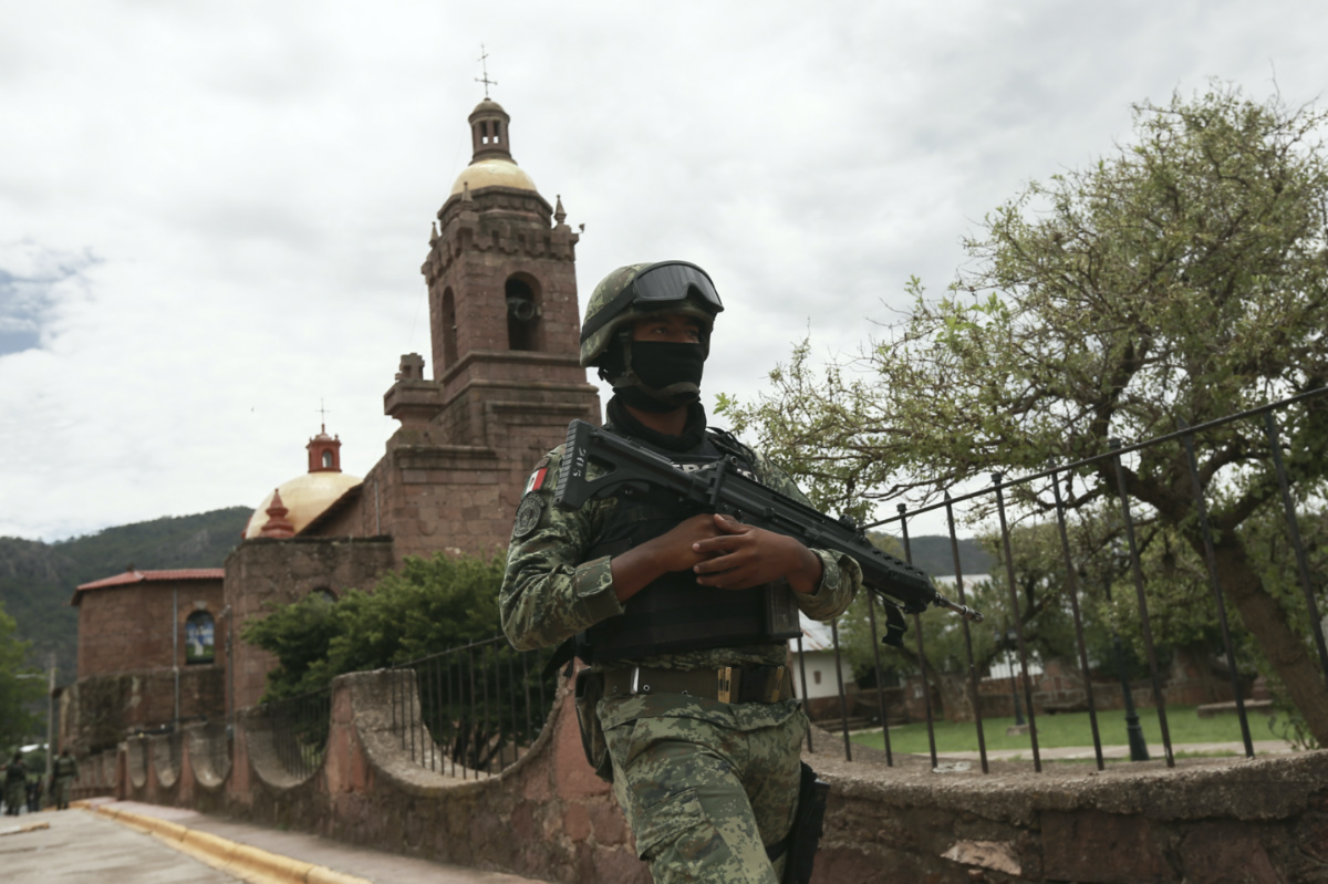 Mexico Cerocahui soldier outside church