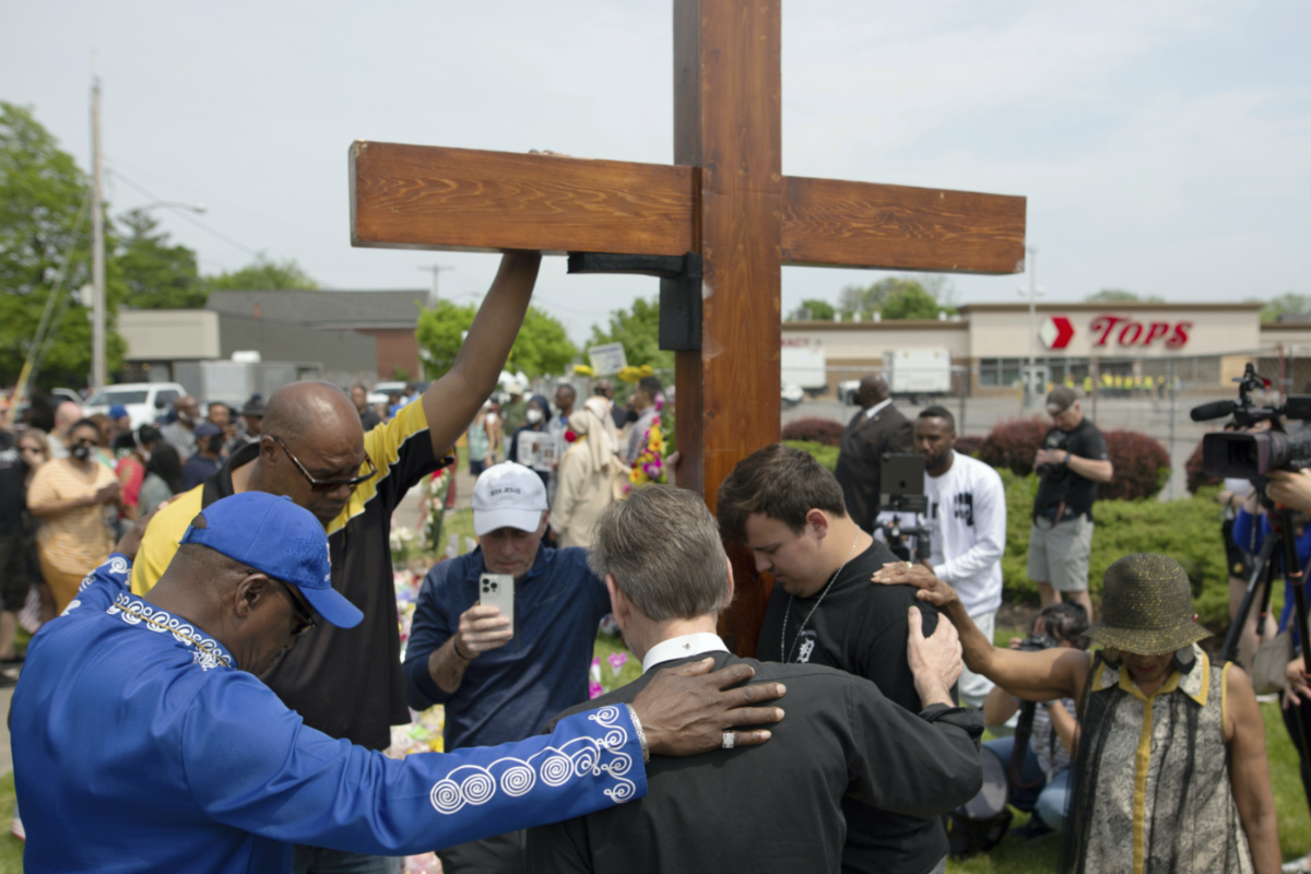 US Buffalo supermarket shooting prayer near a cross