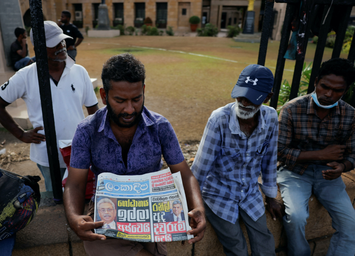 Sri Lanka Colombo reading newspaper