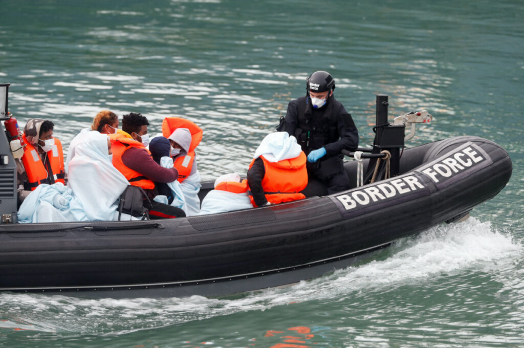 UK Dover Border Patrol agents with migrants