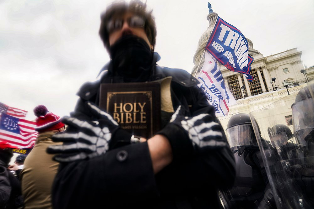 US Capitol man holding Bible