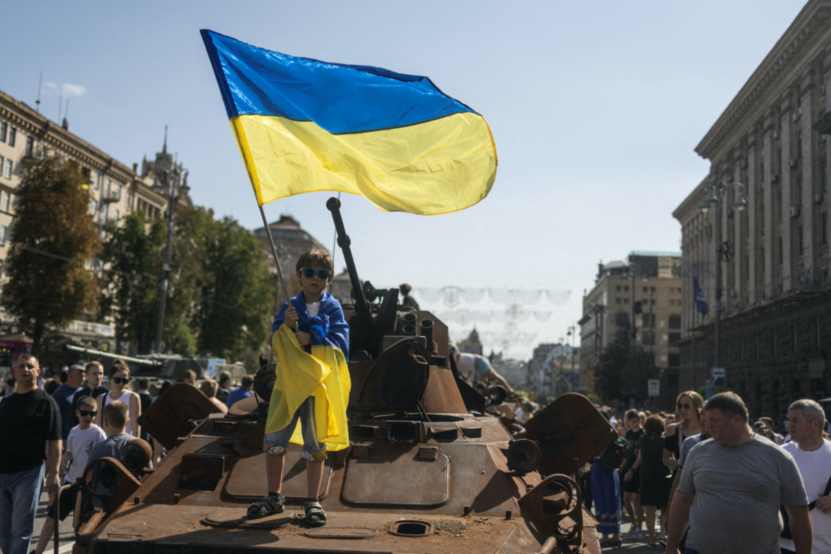 Ukraine Kyiv boy with flag