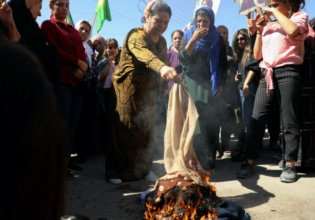 Syria Qamishli burning headscarves