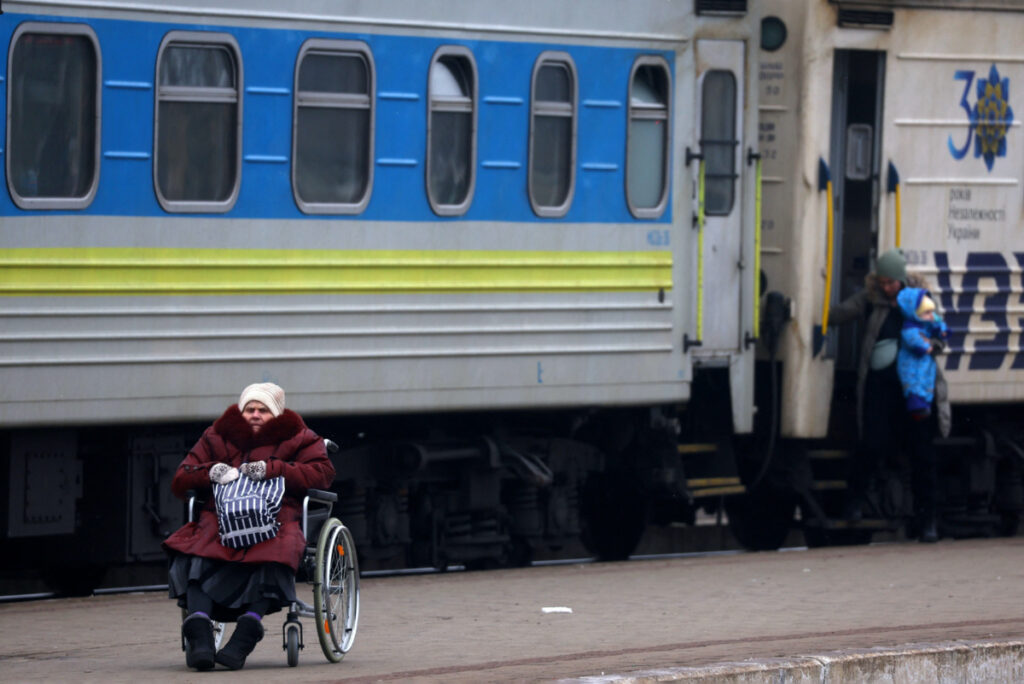 Ukraine Lviv train station person in a wheelchair