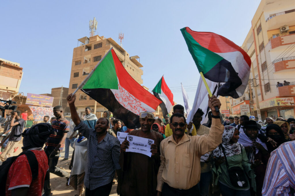 Sudan Khartoum protestors waving flags