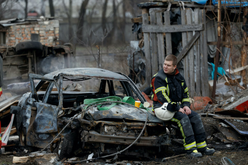 Ukraine Kyiv rescuer at damaged property