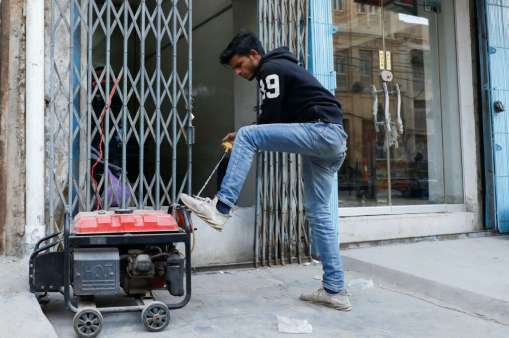 Pakistan Karachi man with generator