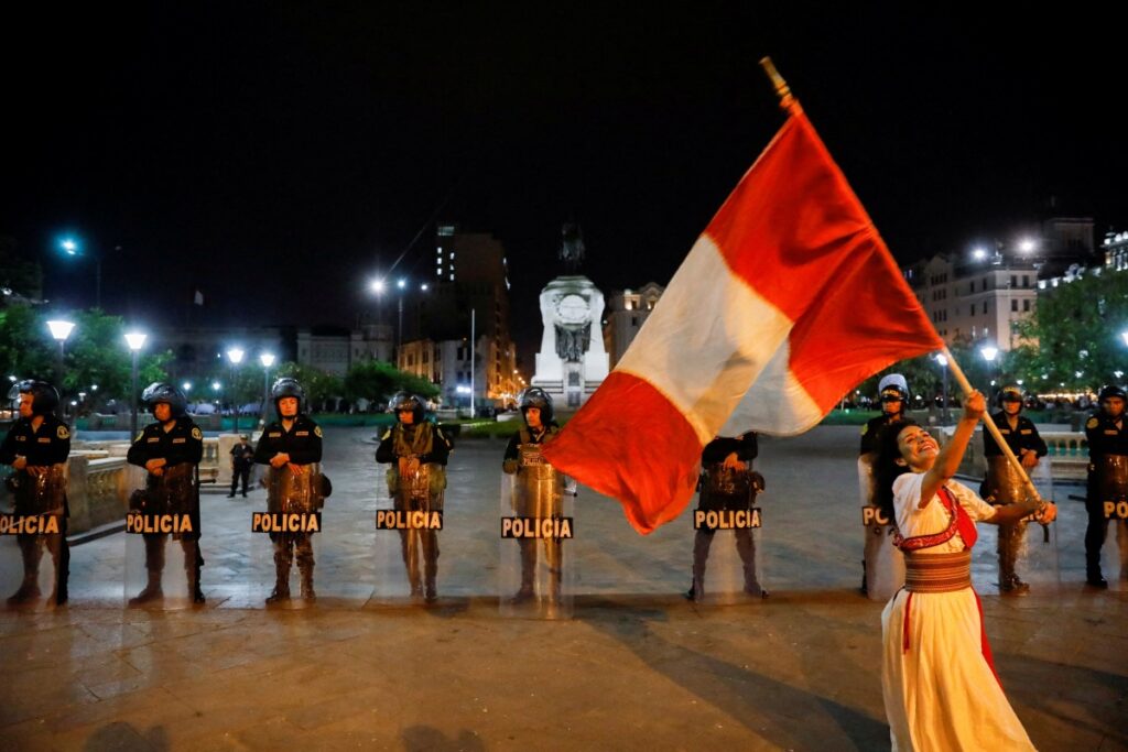 Peru Lima protestor with flag