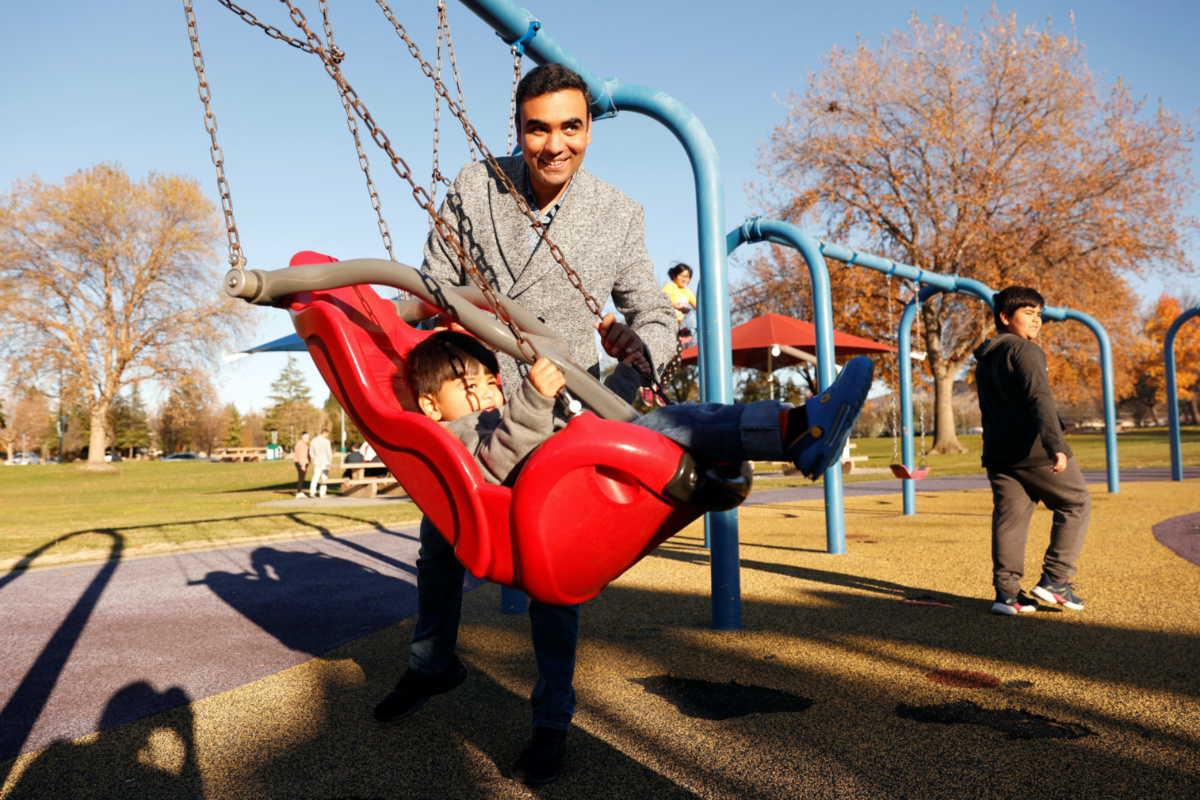 FILE PHOTO: Murtaza Ziwari, 37, an Afghan refugee, plays with his son Ahmad Spanta Ziwari, 2, at Heather Farms Park near their home in Concord, California, U.S., December 13, 2022. REUTERS/Brittany Hosea-Small
