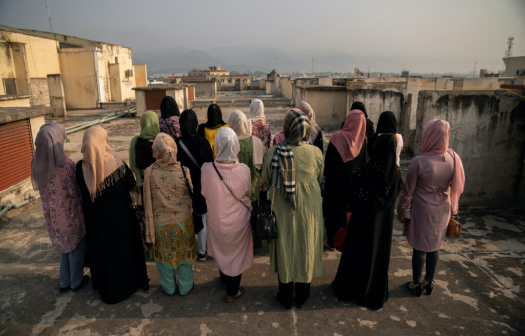 FILE PHOTO: A group of Afghan women prosecutors stand on a rooftop overlooking Islamabad, as they wait for their asylum requests to be addressed after fleeing Afghanistan fearing persecution by the Taliban government, in Islamabad, Pakistan, September 22, 2022. REUTERS/Raul Cadenas de la Vega