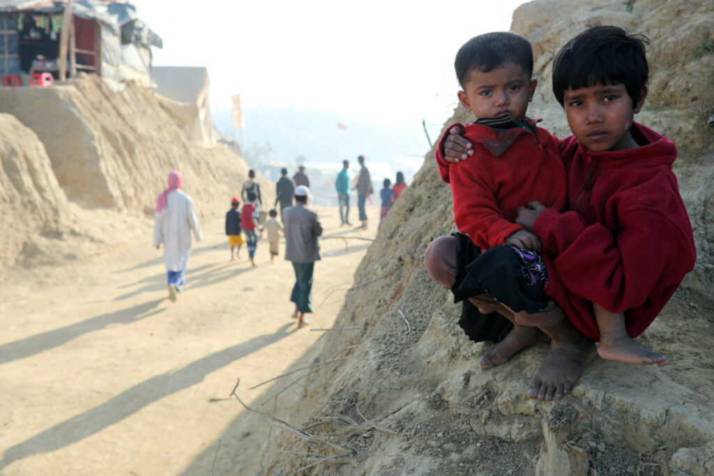 FILE PHOTO: Rohingya refugee children look on at the Jamtoli camp in the morning in Cox's Bazar, Bangladesh, January 22, 2018. REUTERS/Mohammad Ponir Hossain/File Photo