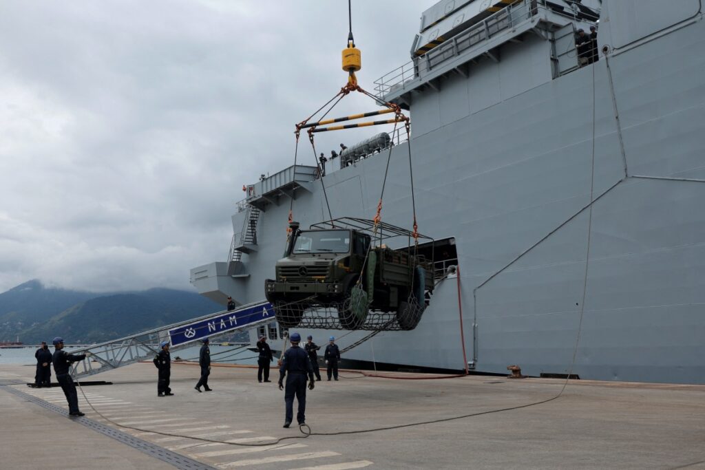 Members of the Brazilian Navy unload a vehicle from the ship Navio Atlantico as part of relief operations for victims of landslides in Sao Sebastiao, Brazil February 23, 2023.