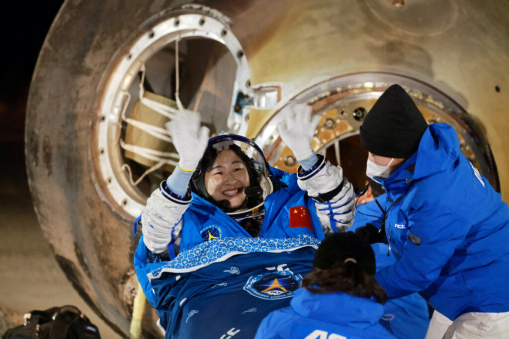 FILE PHOTO: Astronaut Liu Yang waves as she is out of a return capsule of the Shenzhou-14 spacecraft, following a six-month mission on China's space station, at the Dongfeng landing site in Inner Mongolia Autonomous Region, China December 4, 2022. China Daily via REUTERS