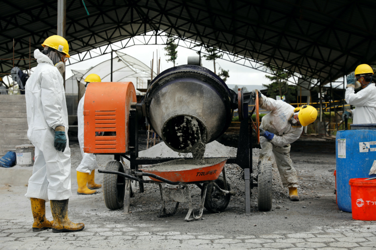 Workers mix seized cocaine and coca paste with industrial waste to produce cement slurry to be used in a construction, at a waste treatment plant, at an undisclosed location, in Ecuador February 10, 2023. 