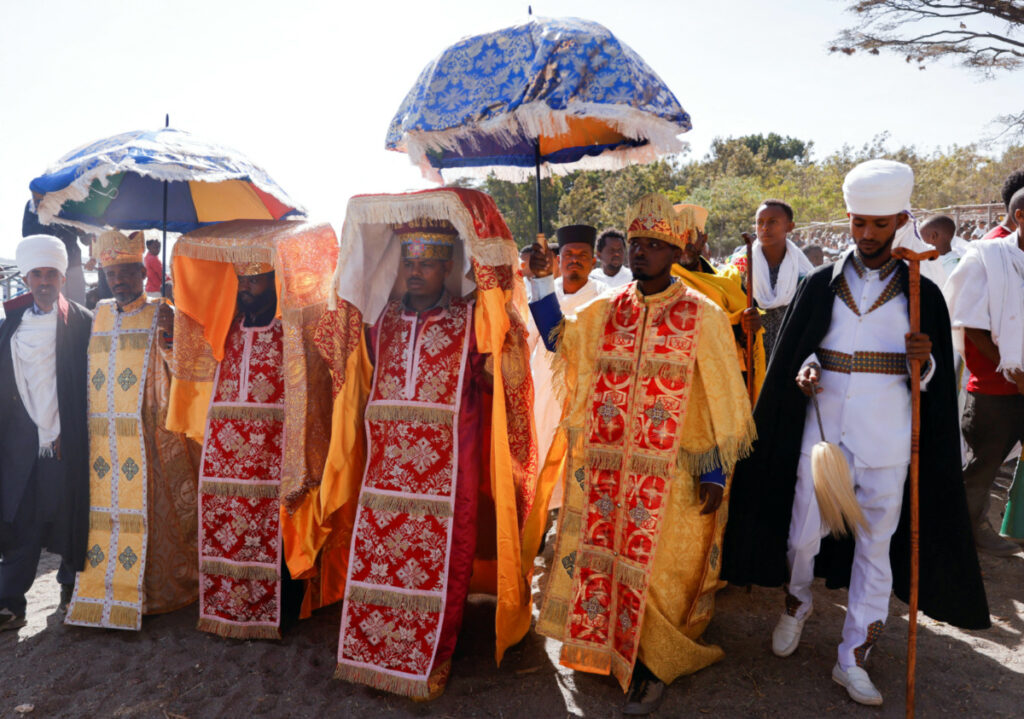FILE PHOTO: Ethiopian Orthodox priests carry ‘Tabot’ the replica of the Ark of the Covenant during Epiphany celebration to commemorate the baptism of Jesus Christ on Lake Dambal in Batu town of Oromia Region, Ethiopia on January 19, 2023. REUTERS/Tiksa Negeri/File P