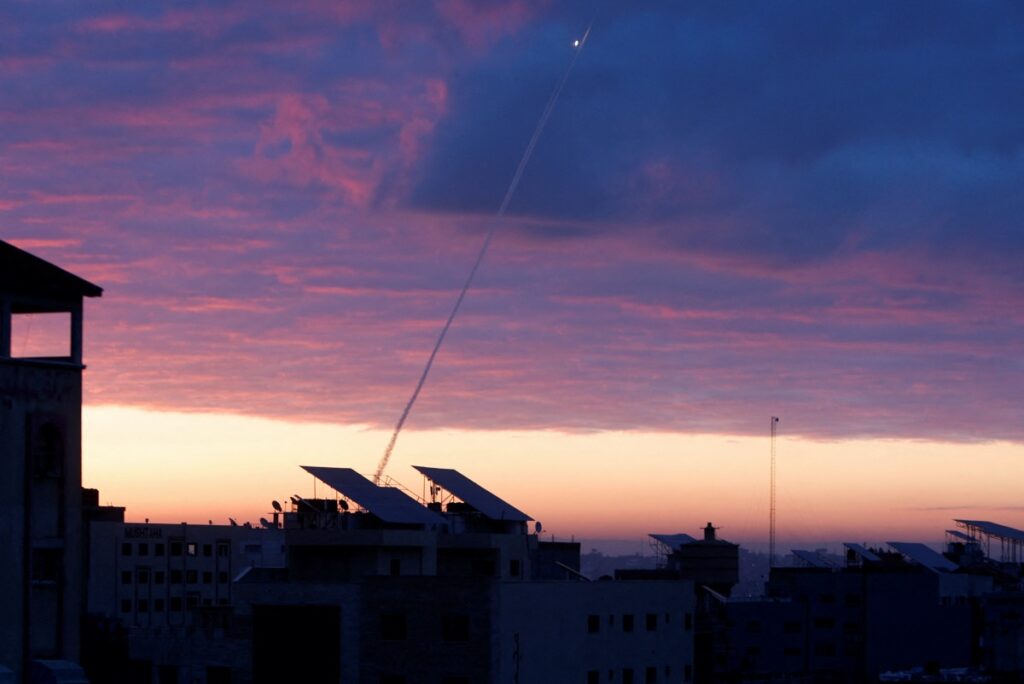 Trails of smoke are seen as rockets are fired from Gaza towards Israel during the sunrise, in Gaza City February 23, 2023.