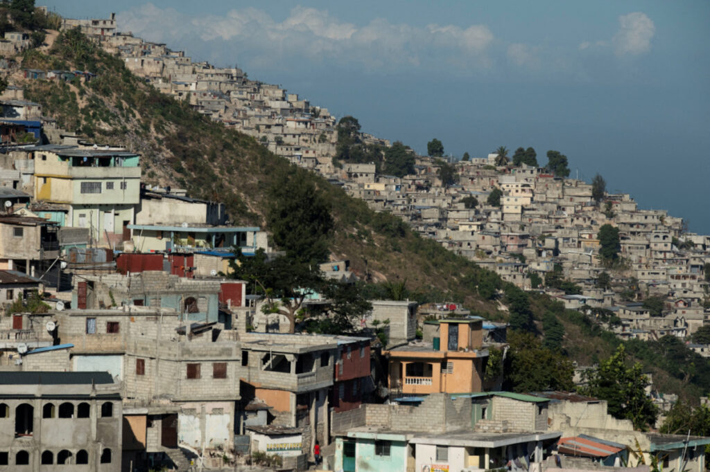 FILE PHOTO: Houses pack a hillside in the Jalousie district of Port-au-Prince, Haiti, February 3, 2023. REUTERS/Ricardo Arduengo