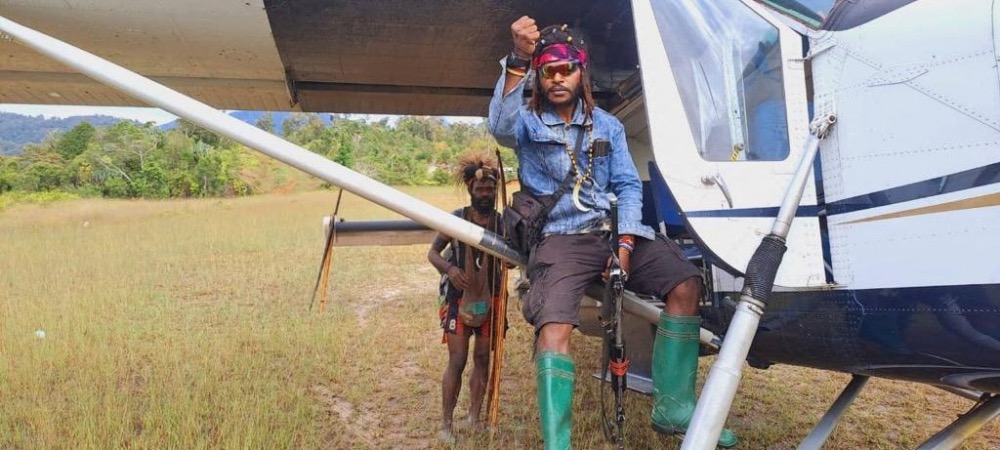 Egianus Kogoya, young West Papuan rebel commander, sits on a captured plane piloted by New Zealand national Philip Mehrtens in Indonesia's Papua region in this undated picture released on February 14, 2023.
